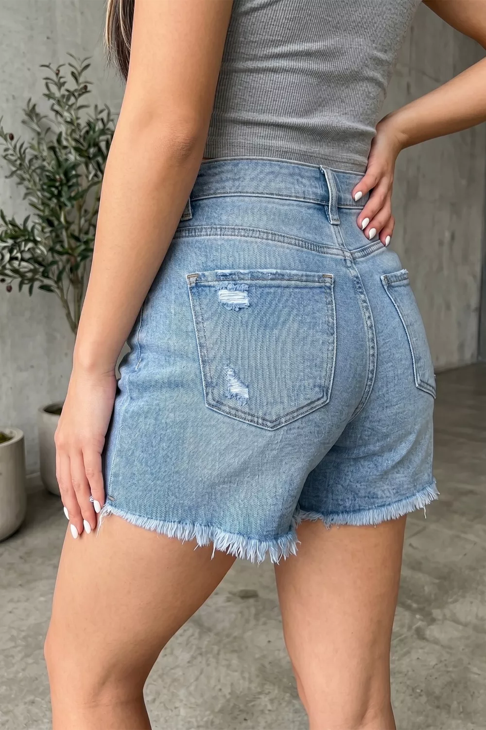 Asymmetric Raw Hem Distressed Whiskery Denim Shorts - Image 2